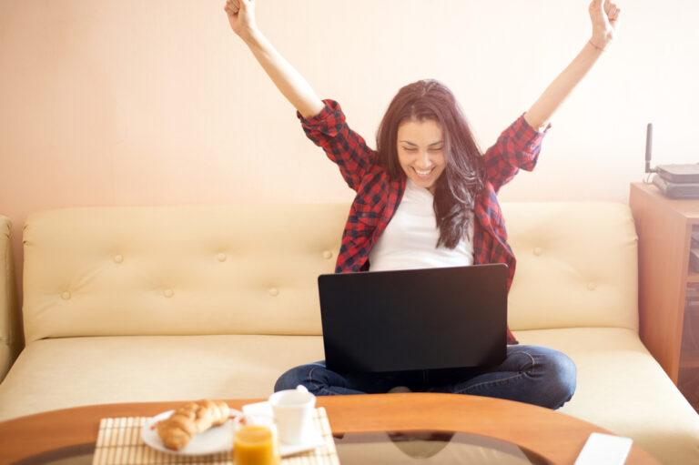 Happy woman with laptop ,excited face expression